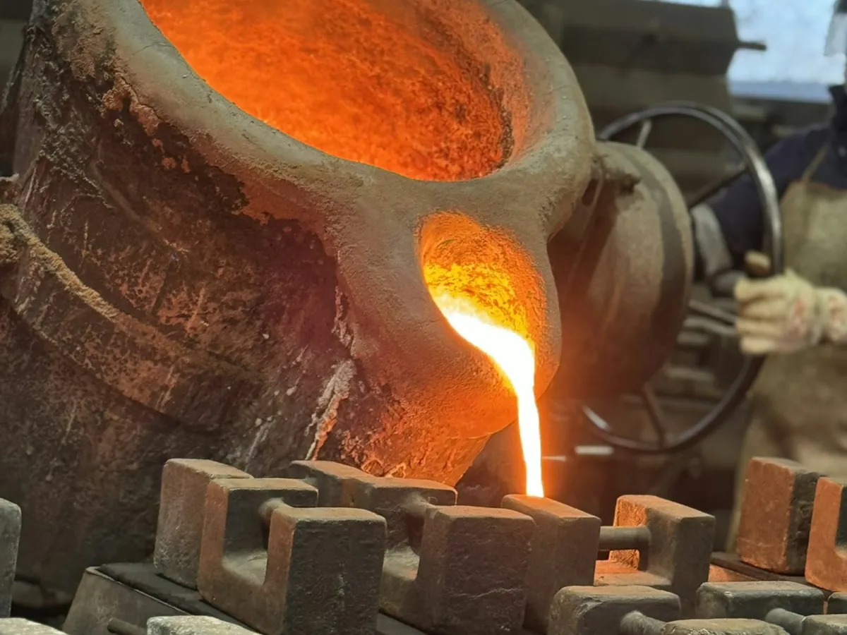 Illustrative image: iron being poured into sand moulds